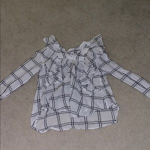 Nice plaid top, with ruffles and a slit at the top